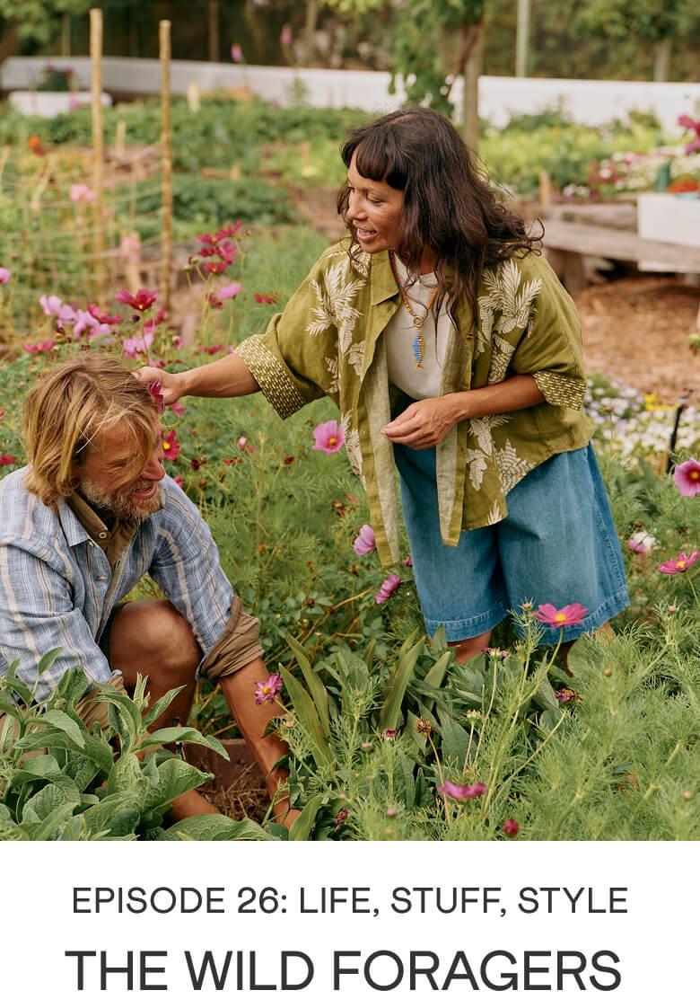 a man and woman in a garden with a sign that reads the wild foragers
