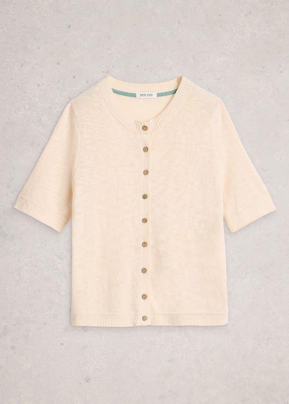 the cardigan sweater is made from a soft beige knit