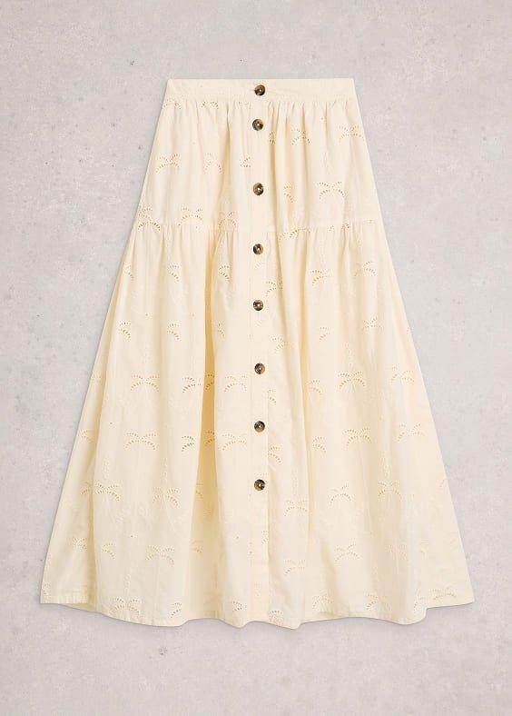 a white skirt with buttons on it