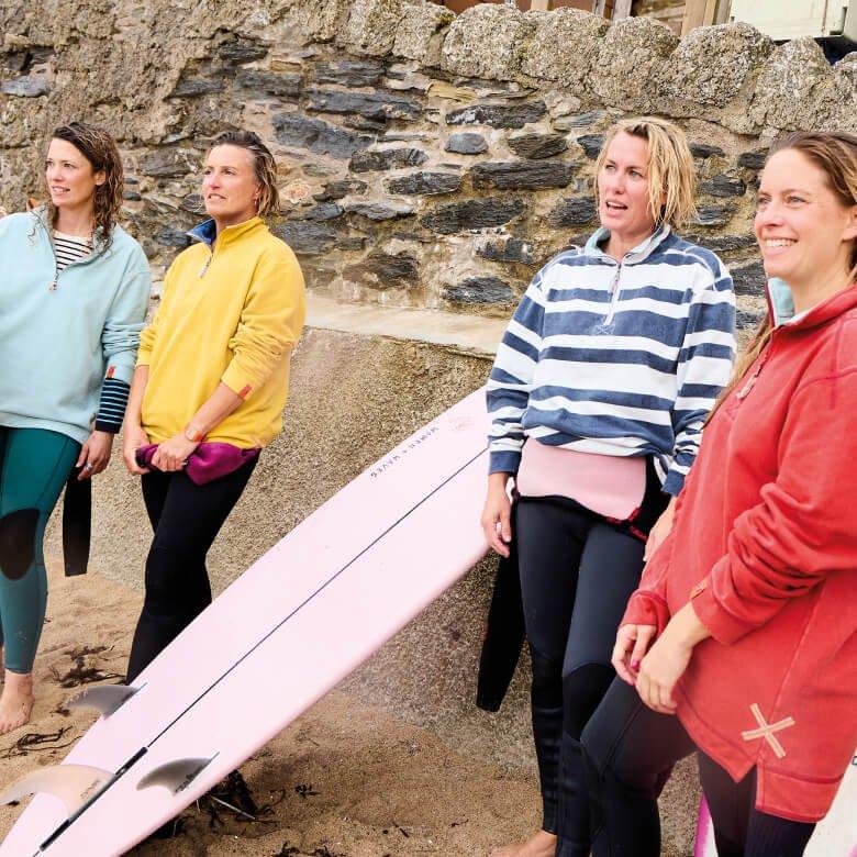 group with surfboard