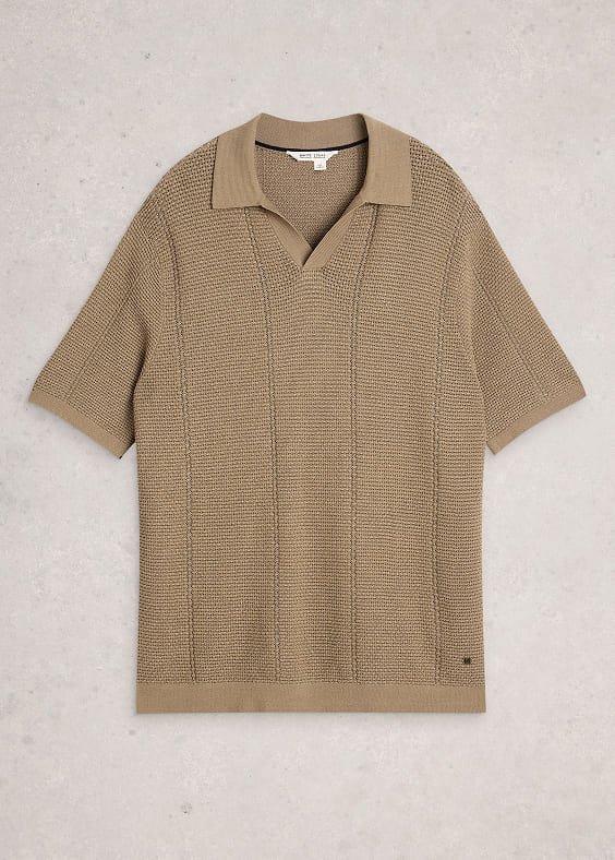 a tan sweater with a knit collar and a short sleeve