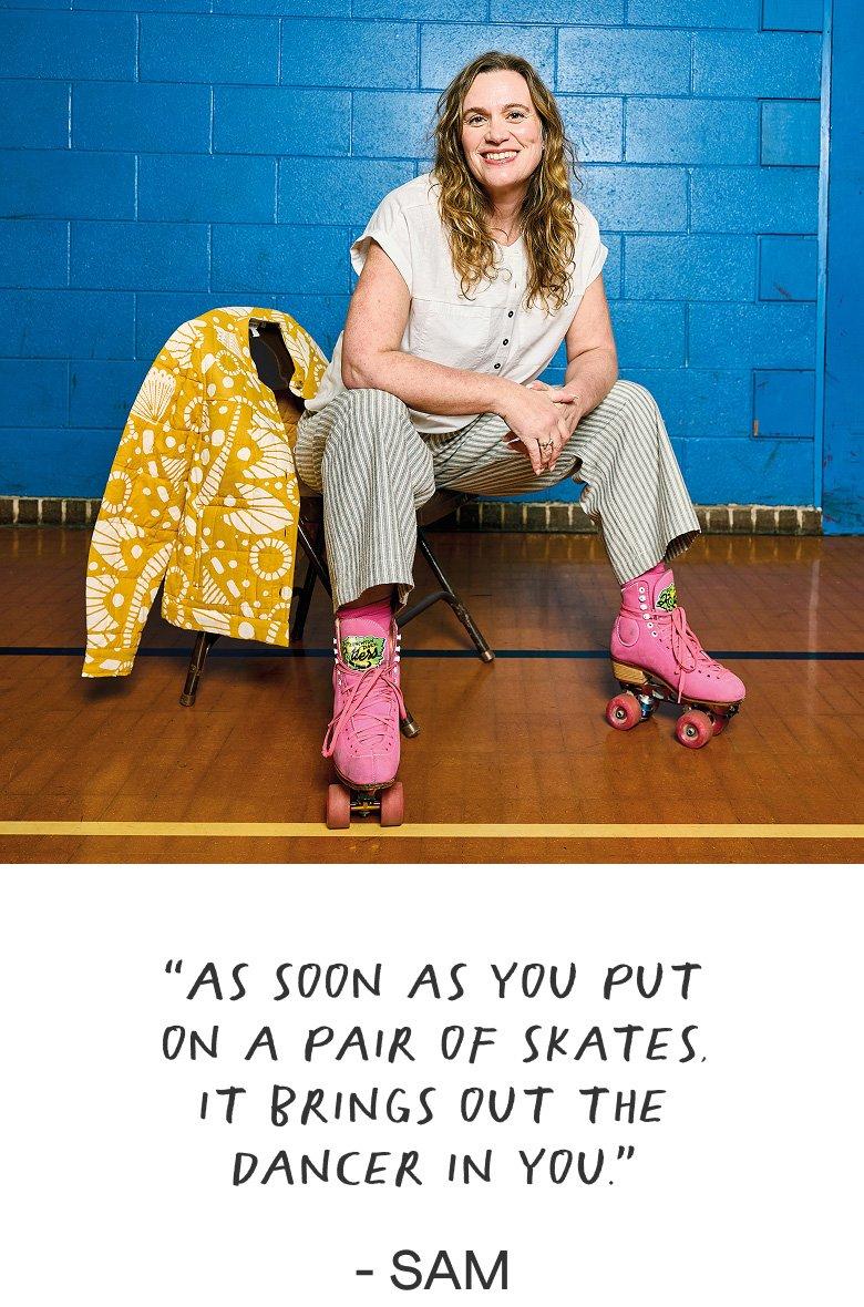 a woman sitting on a chair with pink roller skates on