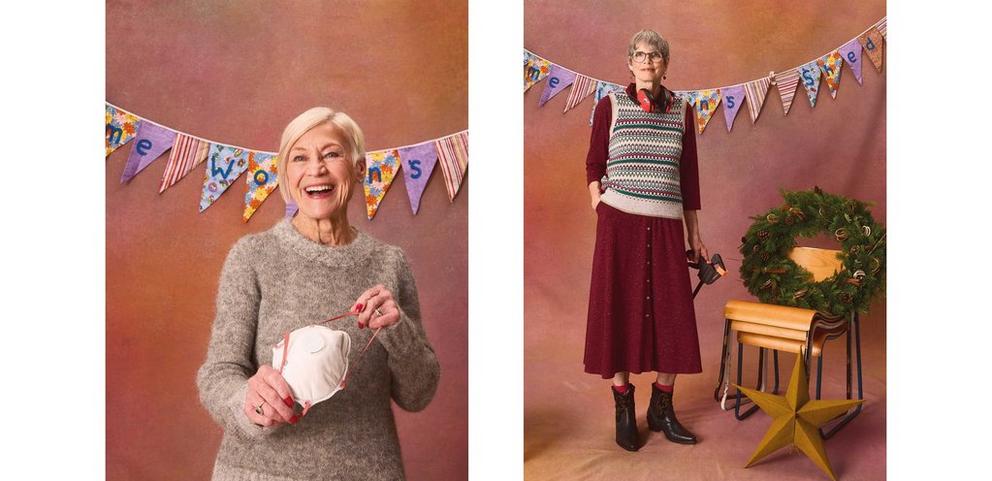 women in front of bunting