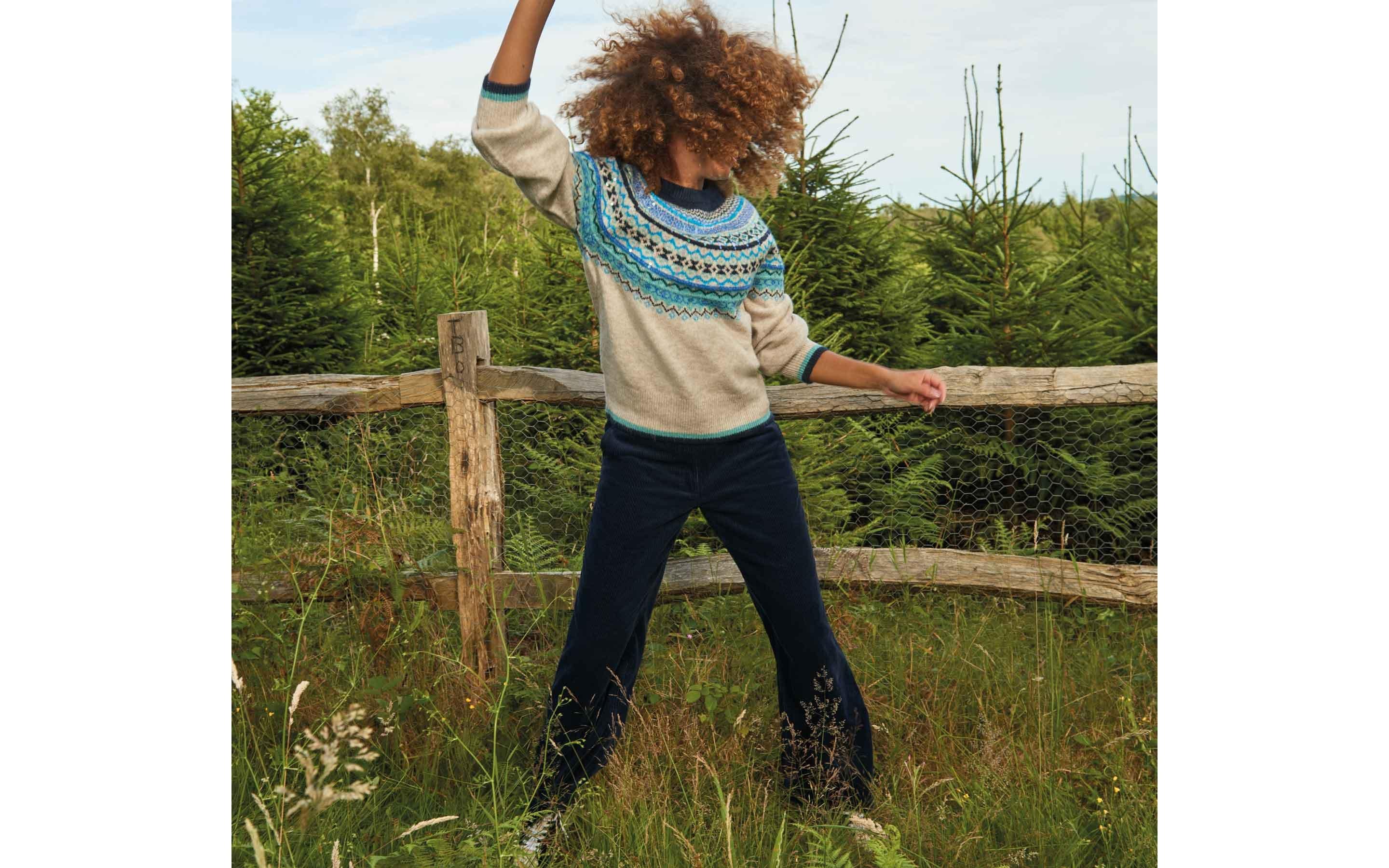 woman dancing in fairisle jumper