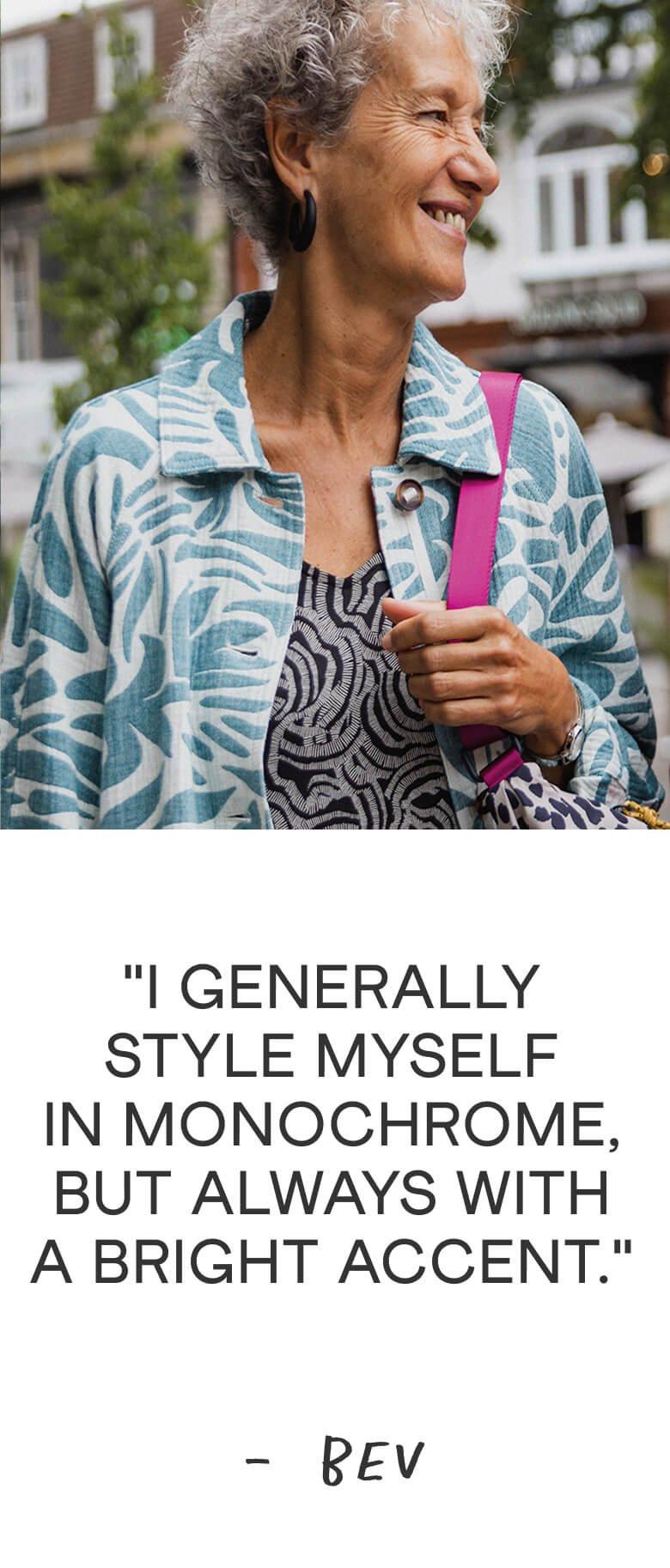 a woman with a smile and a bag on her shoulder