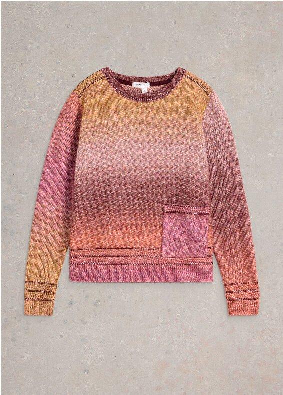 the sweater is made from a pink and orange ombre knit