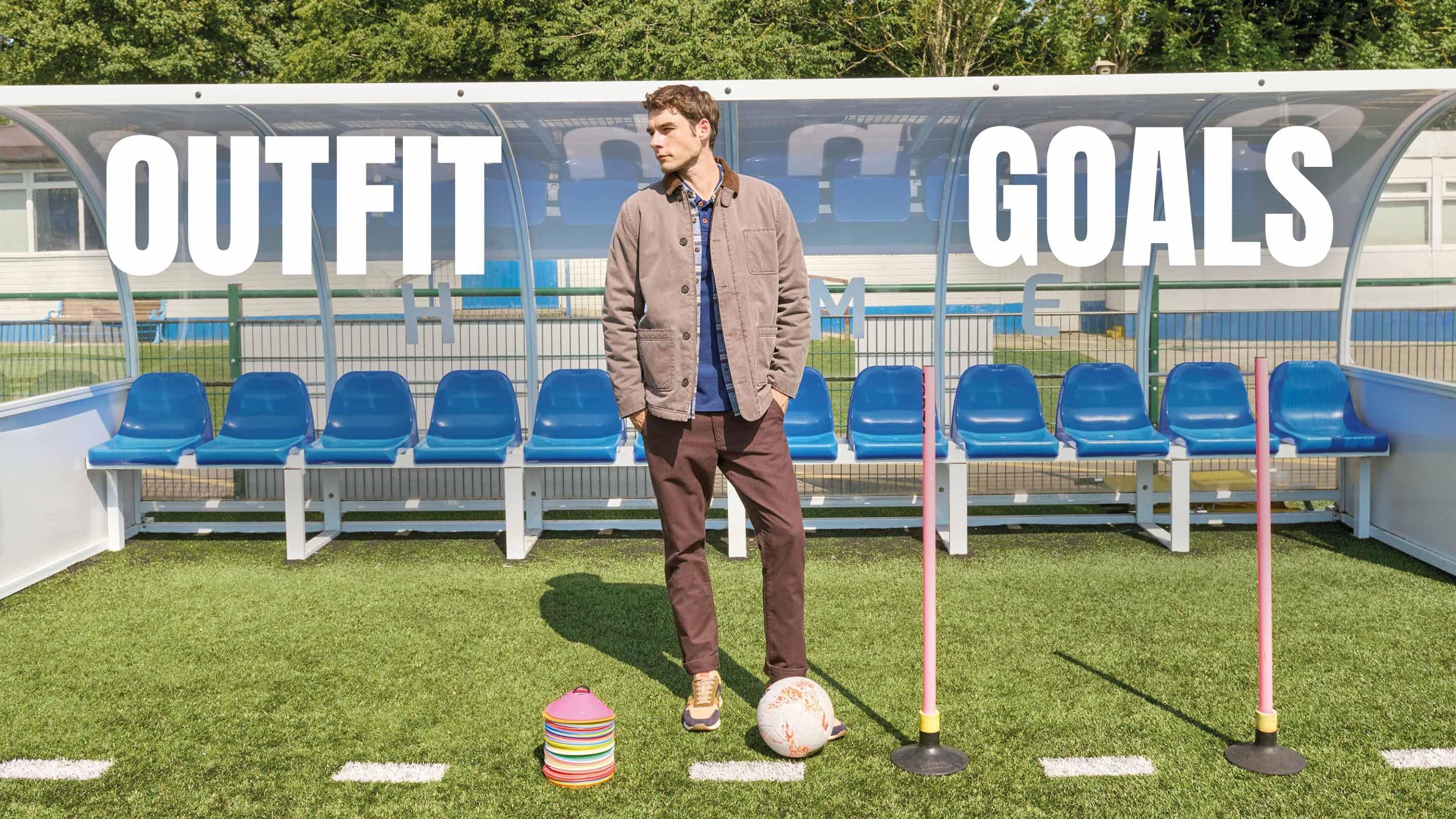 a man standing on a football field with a football 