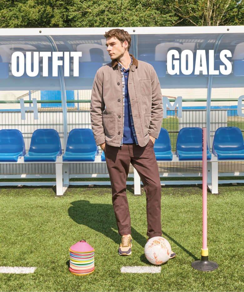 a man standing on a football field with a football 