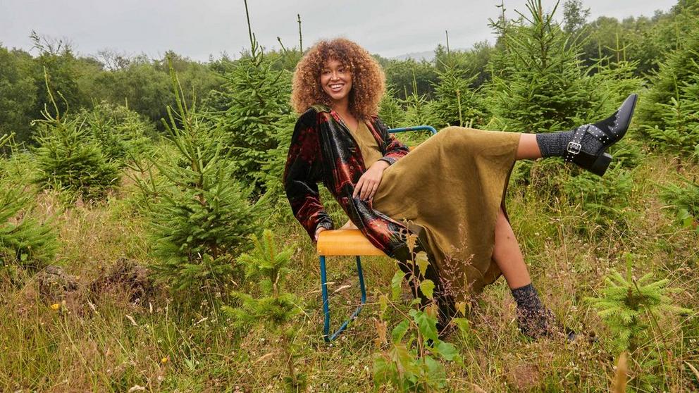 Woman on a chair in a Christmas tree farm
