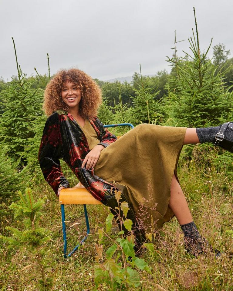 Woman on a chair in a Christmas tree farm