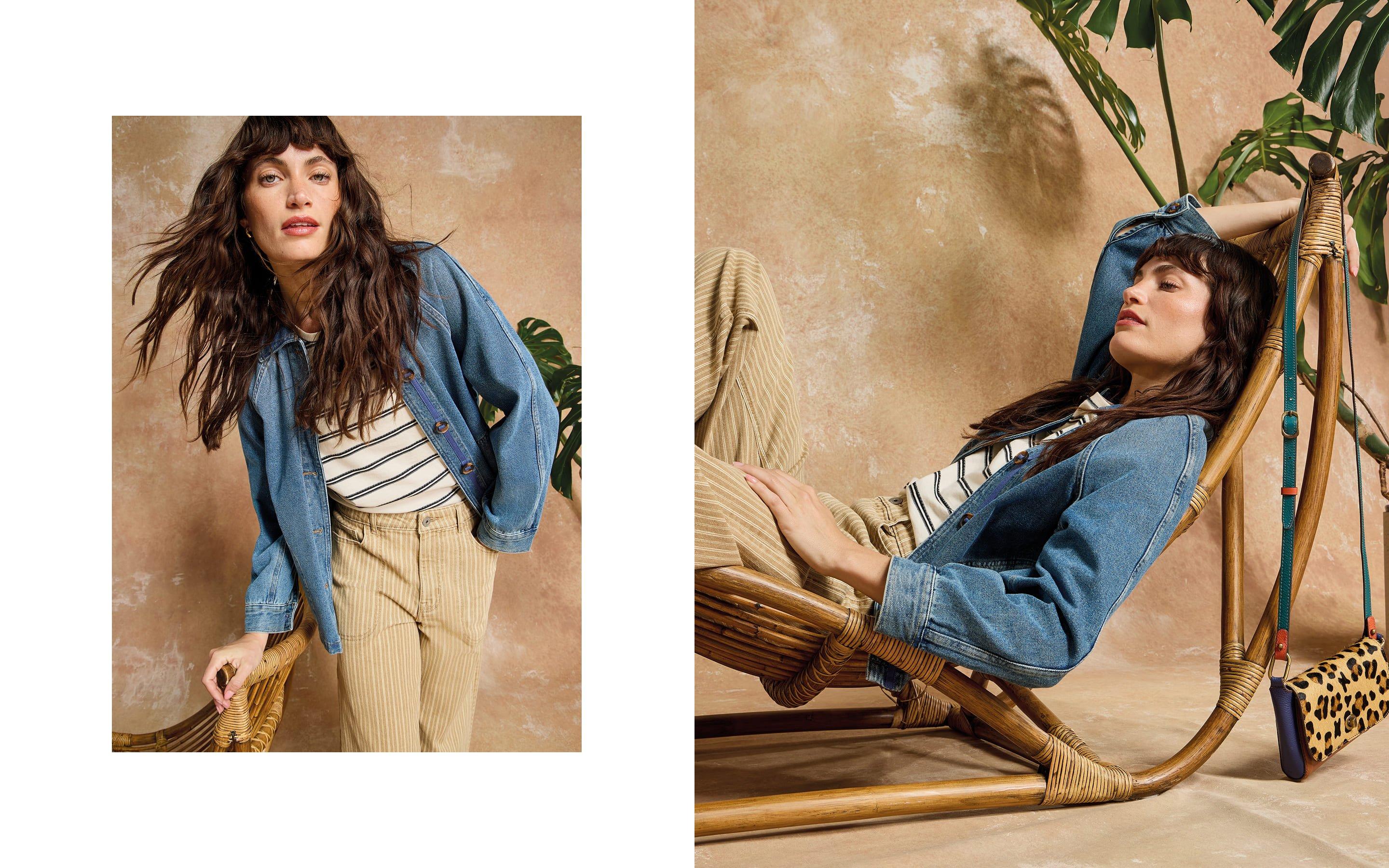 a woman in a denim jacket and leopard print bag is sitting on a chair