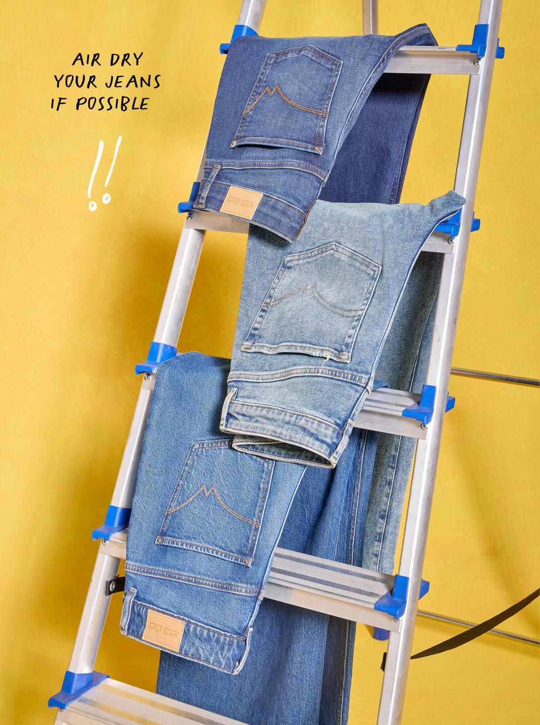 Jeans drying on a ladder.