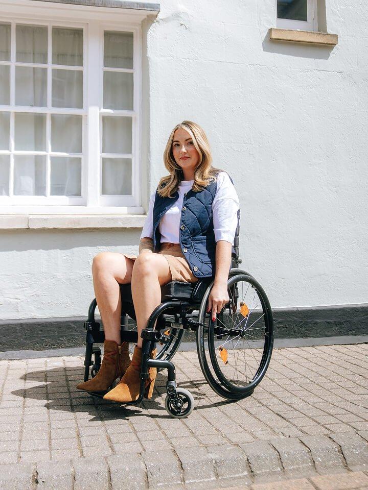 a woman in a wheelchair wearing a White Stuff gilet