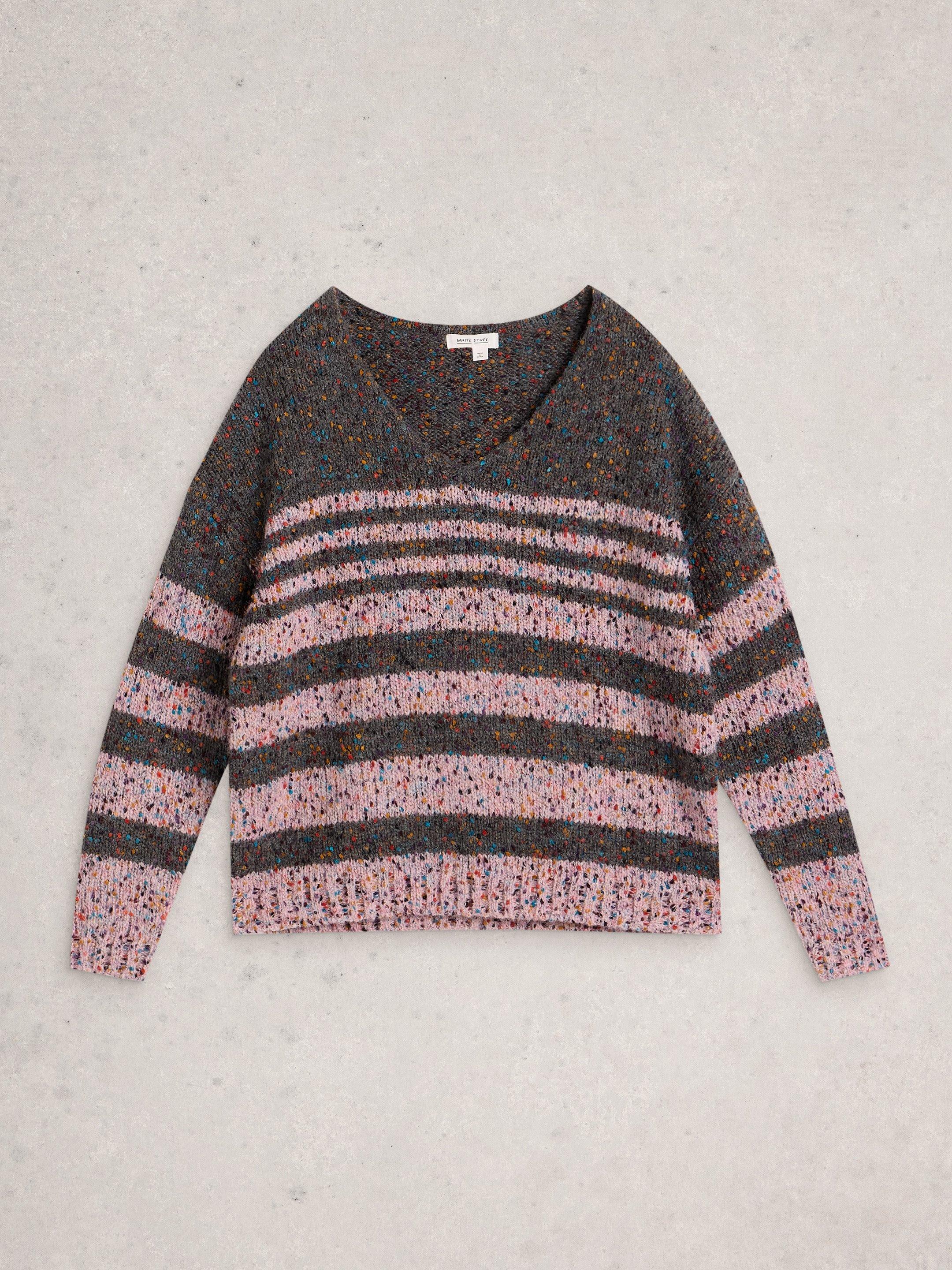 a close up of a knitted fabric with multi colored spots