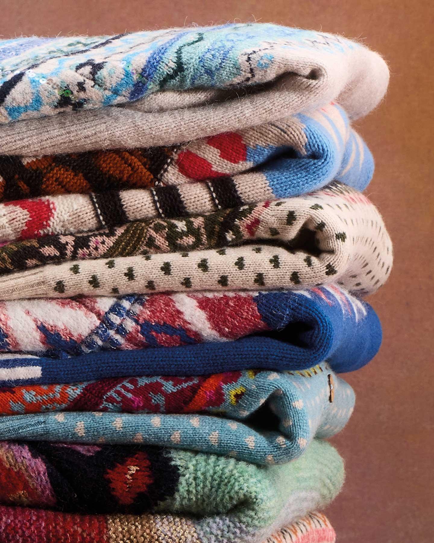 STACK OF KNITTED JUMPERS