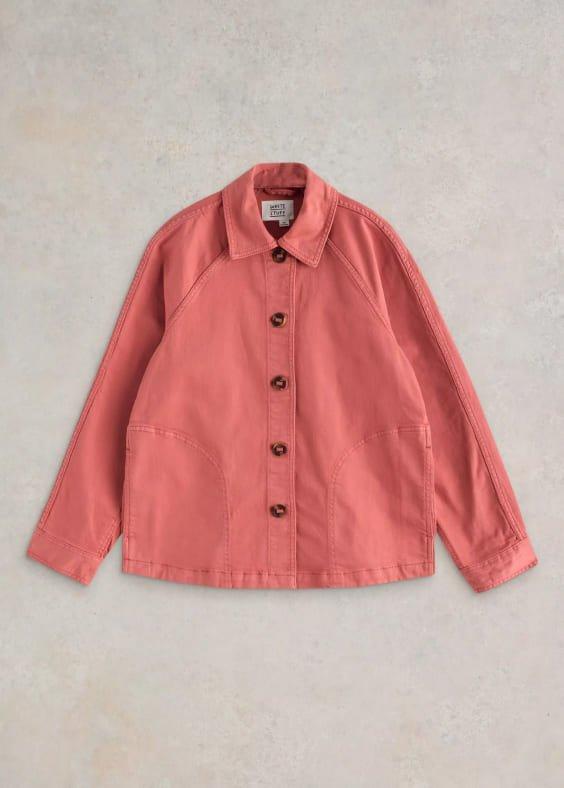 a pink denim jacket with buttons on the front