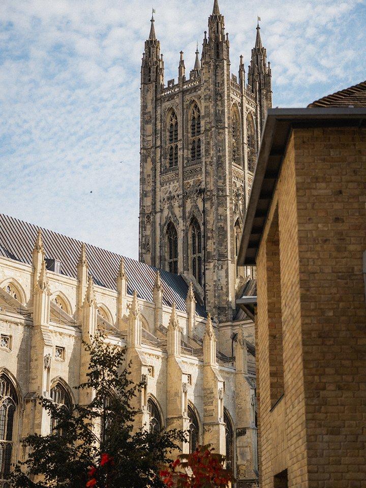 a large cathedral with a clock tower in the background