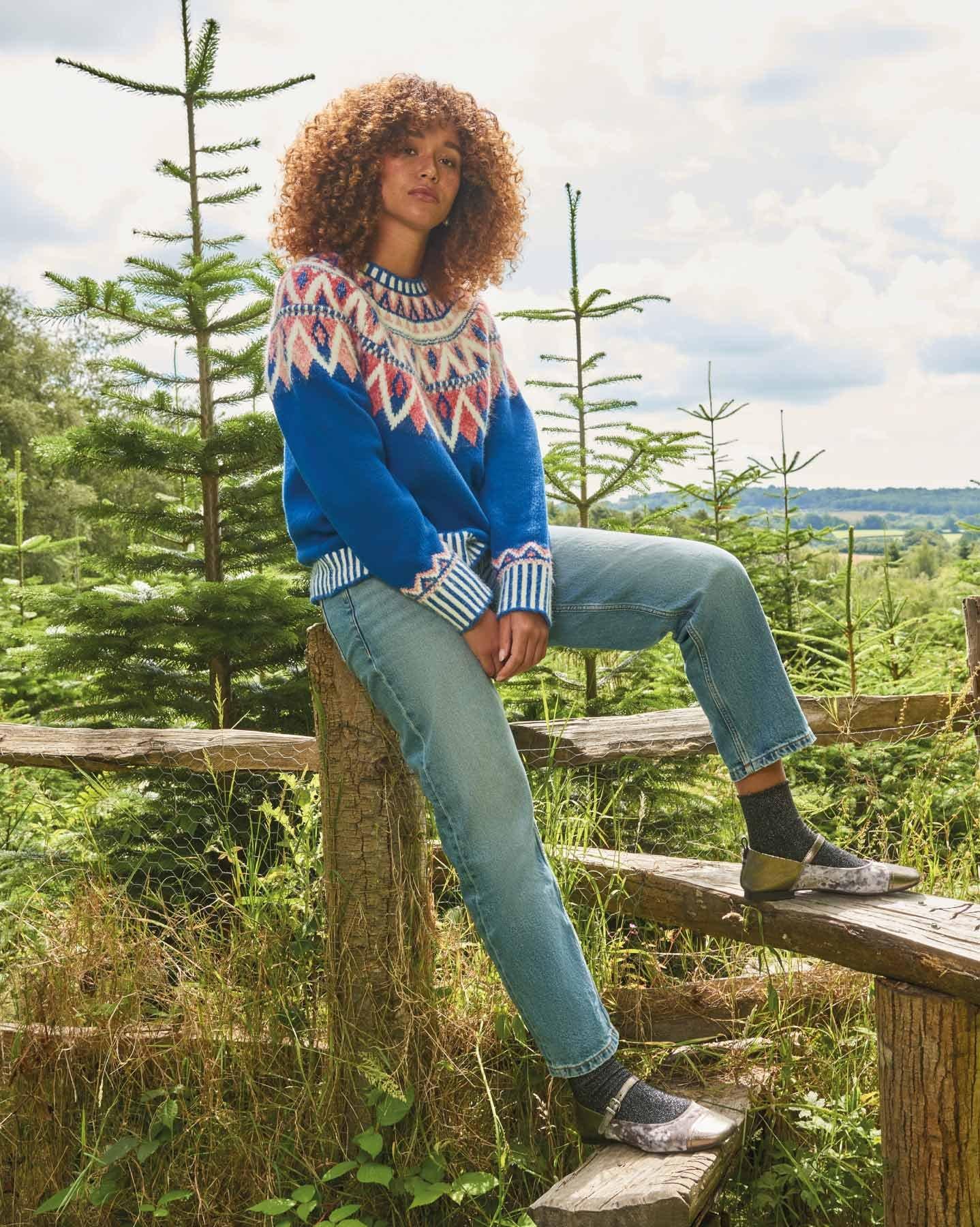 woman in fairisle jumper in pine nursery