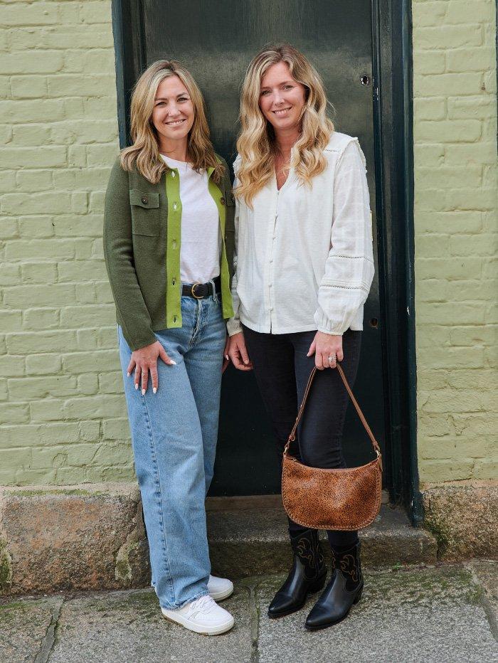 two women in trousers and blouses