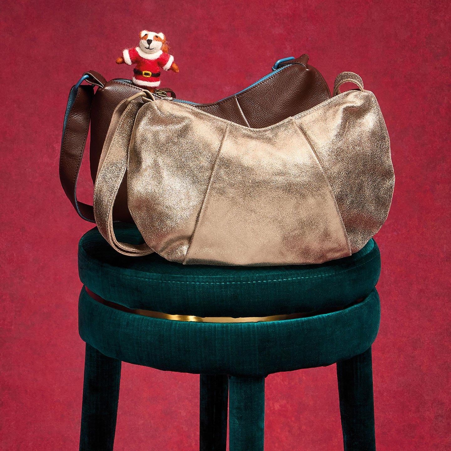 a bag on a stool with a stuffed animal