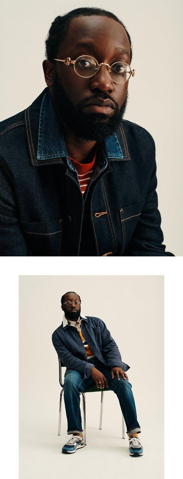 a man in DENIM sitting on a chair 