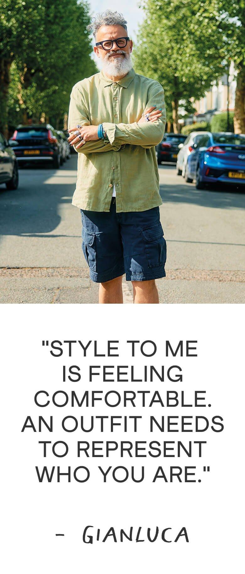 a man standing on a street with a shirt and a quote