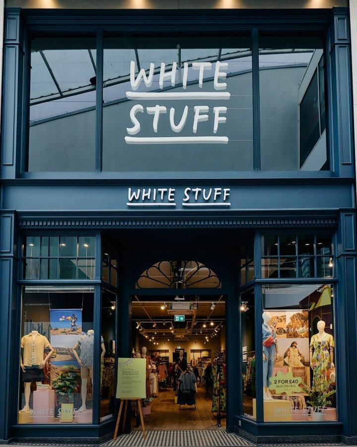 a store front with a sign that says white stuff