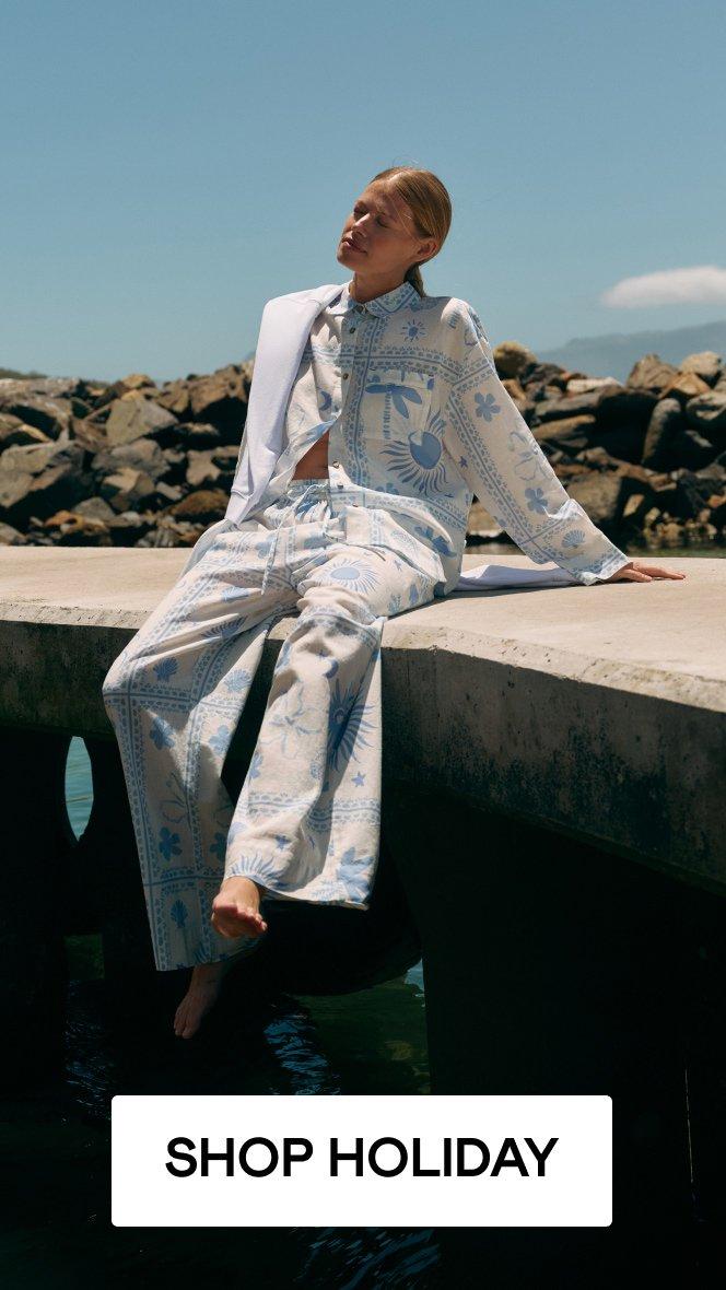 a woman wearing White Stuff, click here to shop holiday clothing.