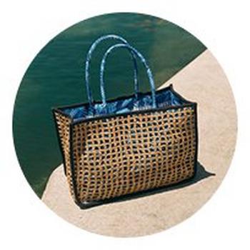 a large woven bag sitting on top of a concrete slab