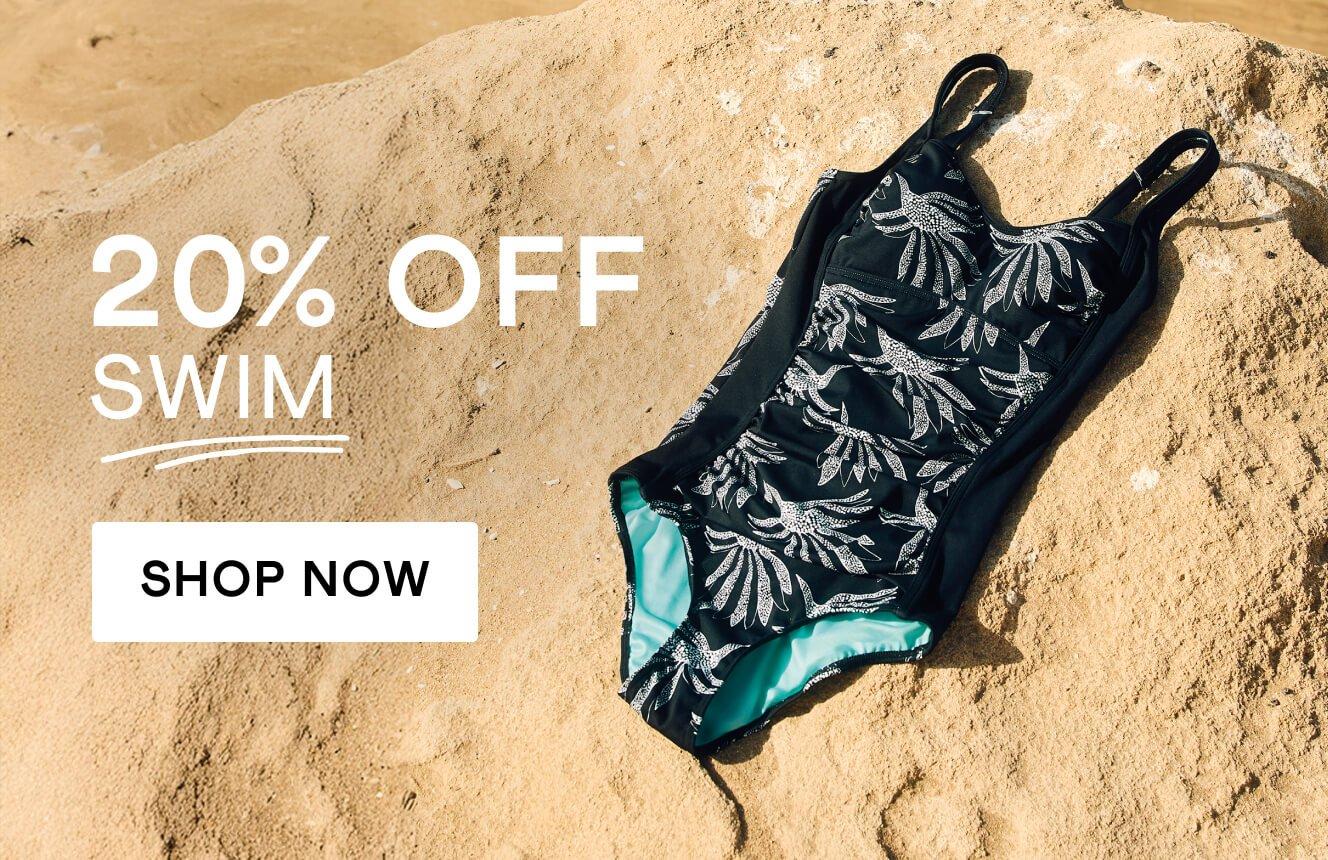 An image of a black swimsuit with blue patterns, layed down on a sandy beach, with the text "20% off swim", Click here to shop swimwear. 