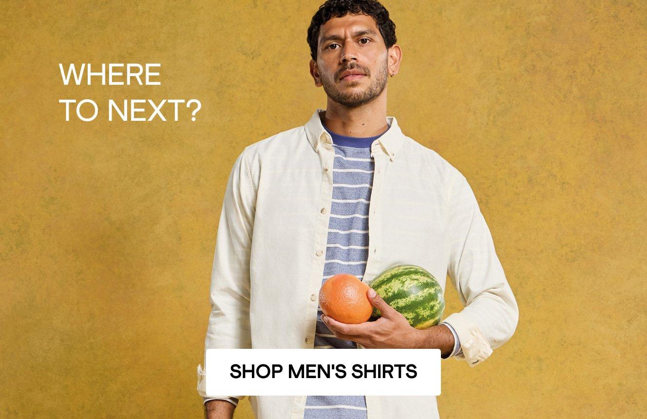 A man wearing a striped tee and a white oxfors shirt, with the words "where to next". Click here to shop men's shirts.