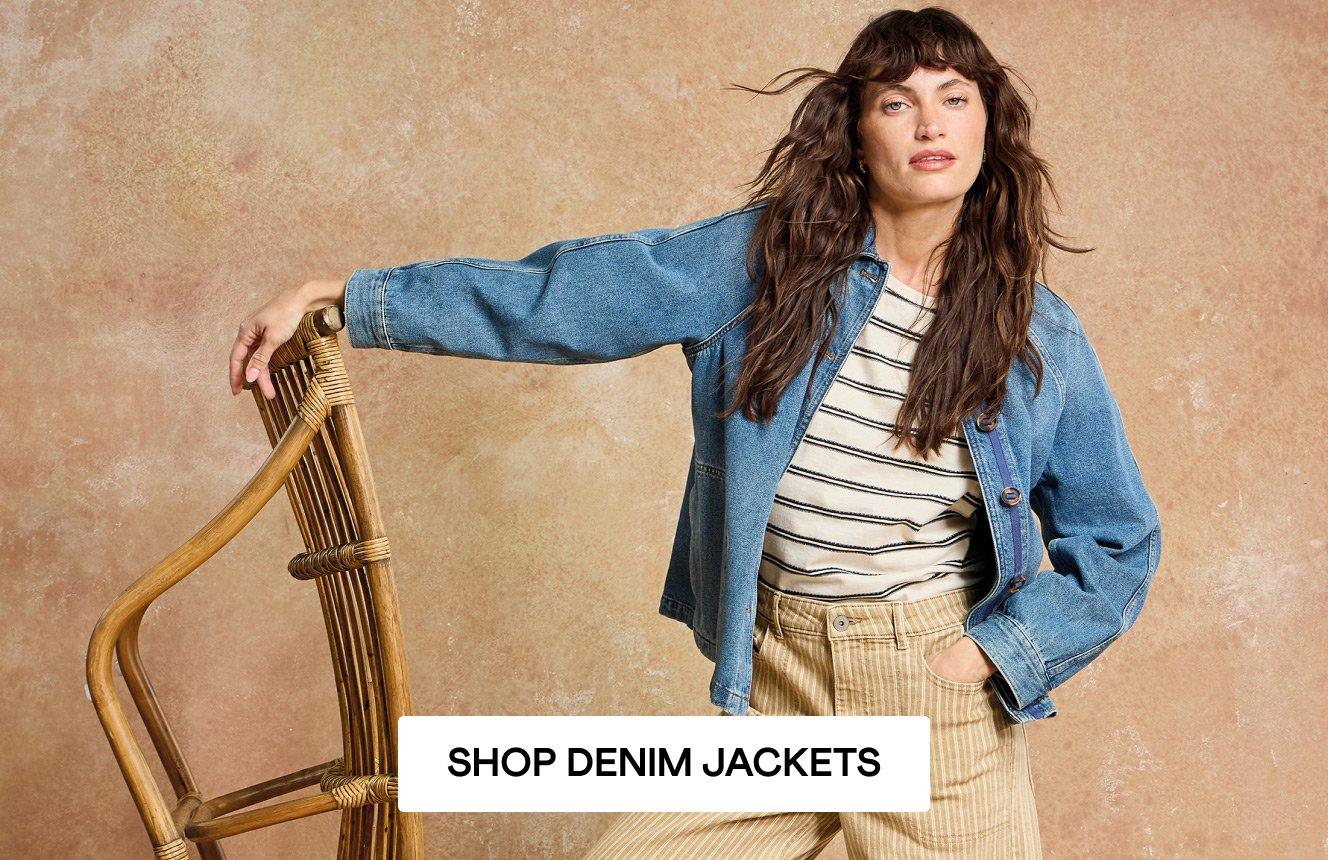 A woman wearing the yellow Tia Jeans and the blue Eden Jacket. Click here to shop denim jackets.