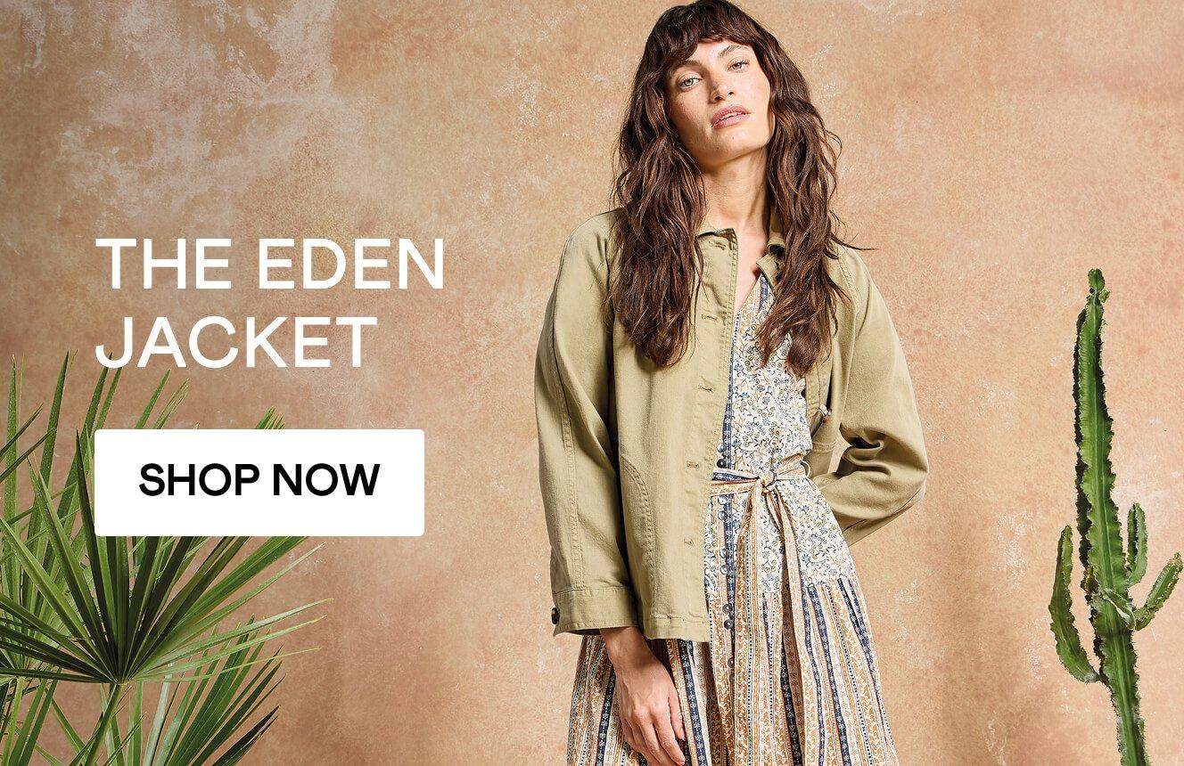 A woman wearing the green Eden Denim Jacket over the beige Clementine dress. Click here to shop Denim Jackets.