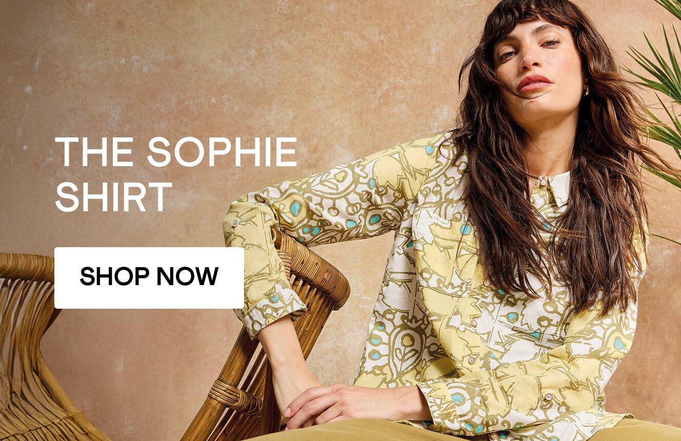 A woman wearing the yellow Sophie Shirt with a floral print.  Click here to shop all Sophie Shirts.