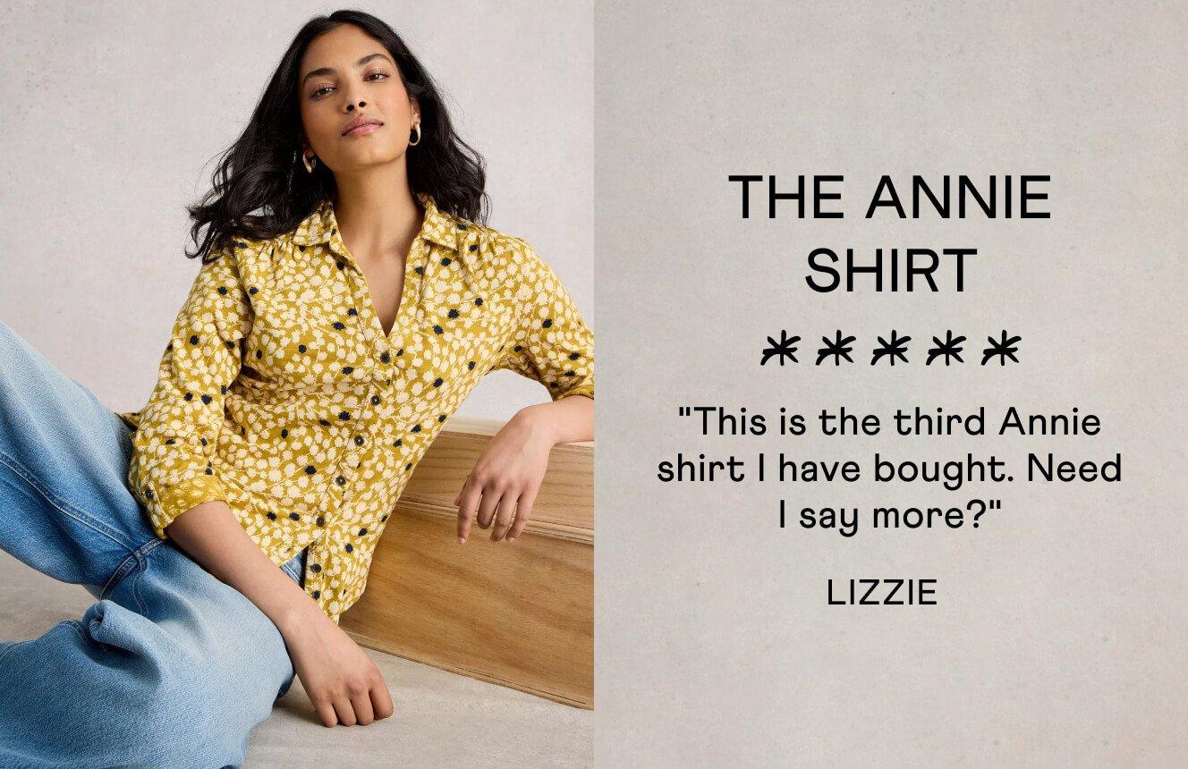 A woman wearing the yellow Annie Shirt with a floral print. Text on the image is a 5 star review by Lizzie: "This is the thirs Annie shirt I have bought. Need I say more?".