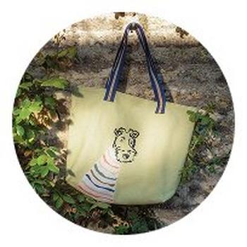 a bag with a dog on it sitting on the ground