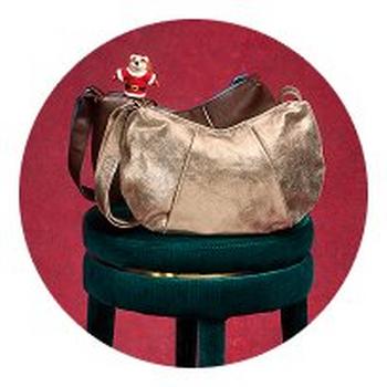 a picture of a purse on a stool with a teddy bear
