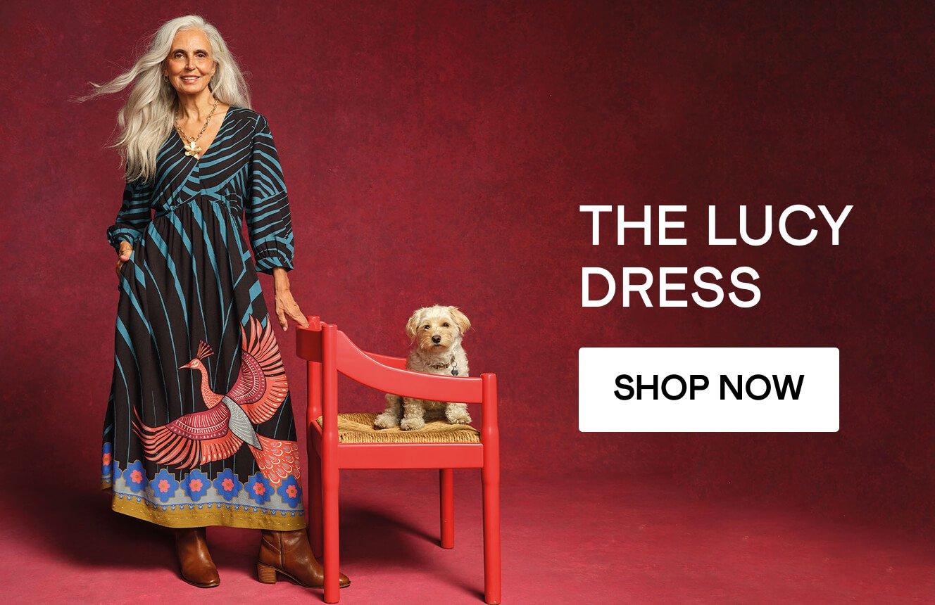 A woman wearing the  Lucy dress. Click here to shop more.