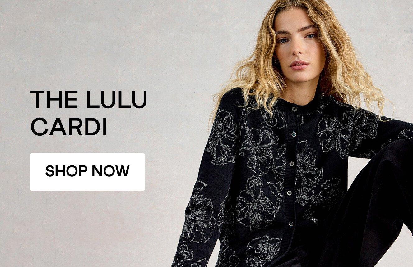 A woman wearing the Lulu cardi. Click here to shop more.