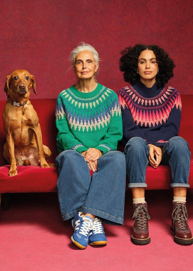 a pair of leopard print shoes on a red cloth