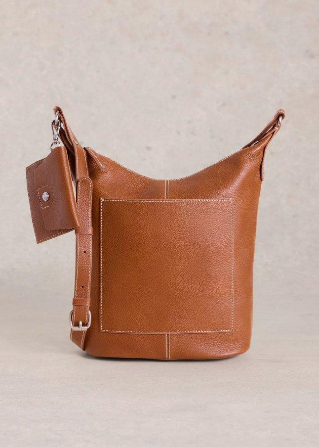 the tan leather bag has a small pocket on the front