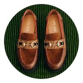 a pair of black ankle boots with yellow zippers