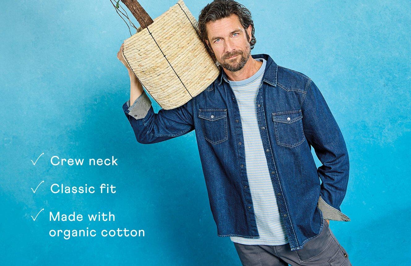 A man wearing the Abersoch Tee. Text on Image is "crew neck, classic fit, made with organic cotton".