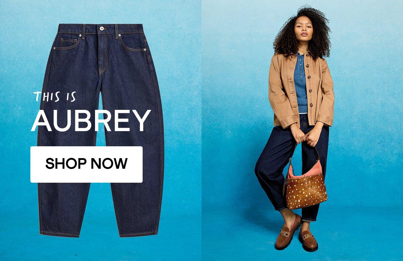 A woman wearing jeans, click here to shop the Aubrey style.