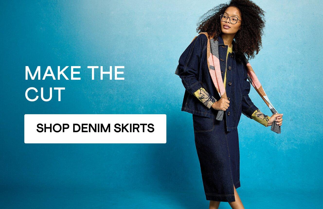 A woman wearing a denim skirt, click here to shop denim skirts.