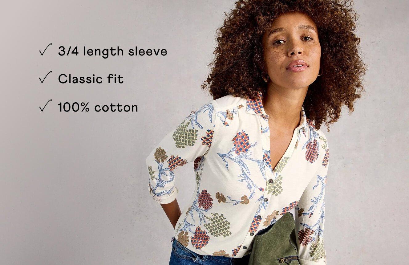 A woman wearing the Annie Shirt. Text on Image is "3/4 length sleeve, classic fit, 100% cotton".