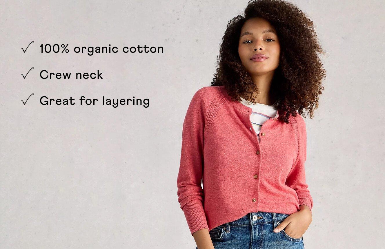 A woman wearing the Lulu Cardigan. Text on Image is "100% organic cotton, crew neck, great for layering".
