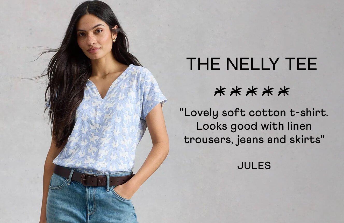 A woman wearing the Nelly Tee. Text on Image is a 5 star review written by Jules: "Lovely soft cotton t-shirt. Looks Good with linen trousers, jeans and skirts".