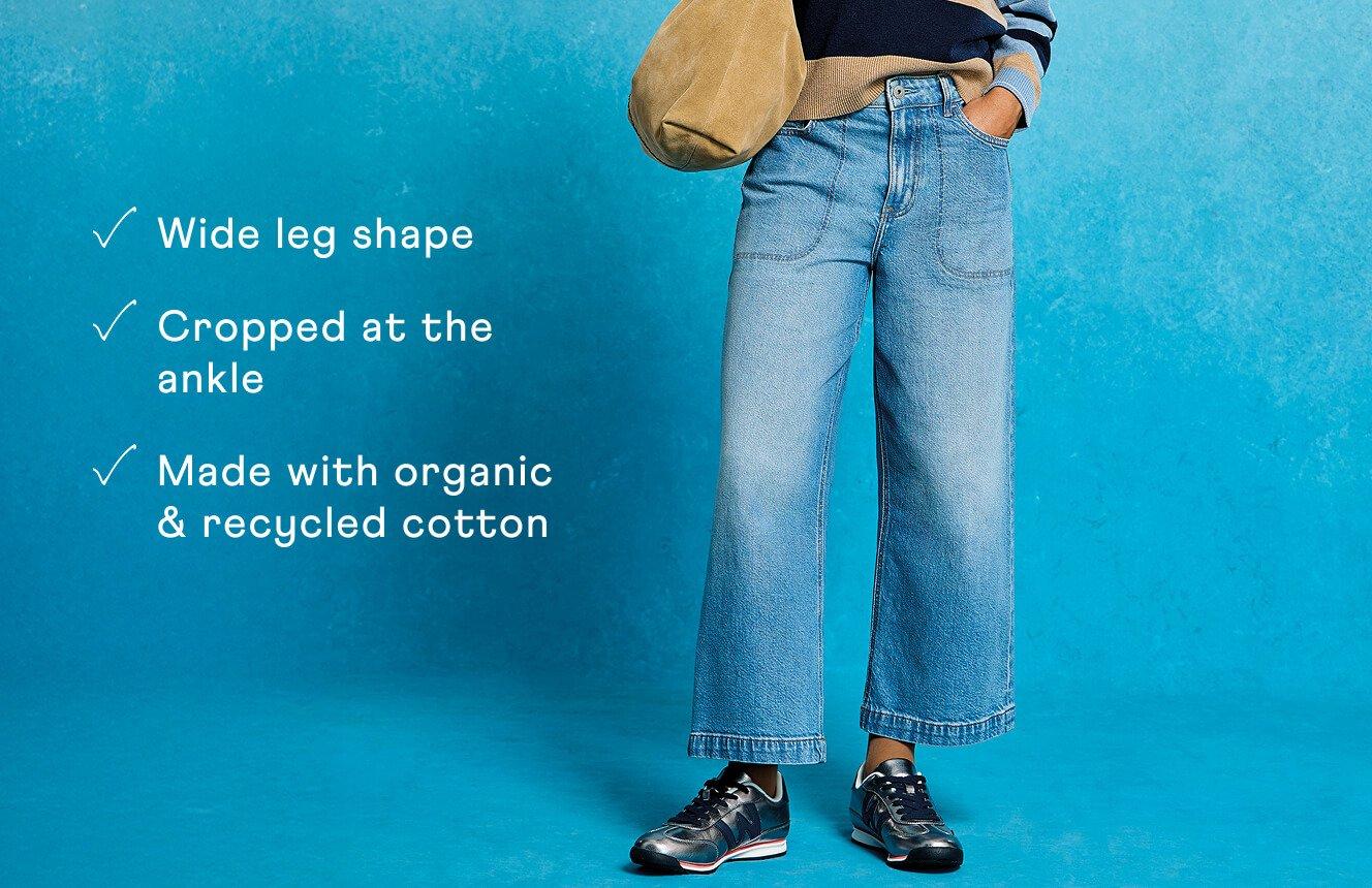 A woman wearing the Tia Jeans. Text on Image is "available in 3 lengths, cropped at the ankle, made with organic & recycled  cotton".