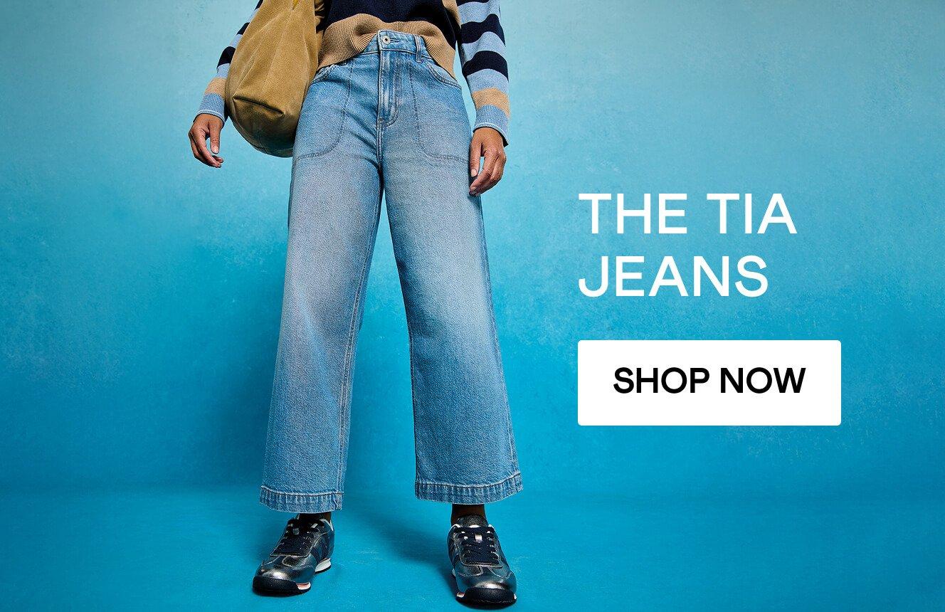 A woman wearing the Tia Jeans. Click here to shop more.